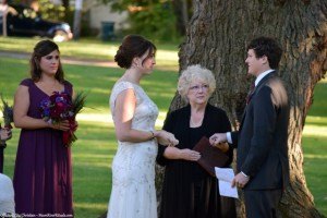 Officiant Zita Christian holds oathing stone for Scotsman groom to make his vows