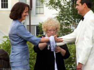 CT Officiant Zita Christian binds the bride and groom in a handfasting ritual.
