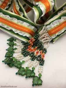 Handfasting cord in orange, green, and white